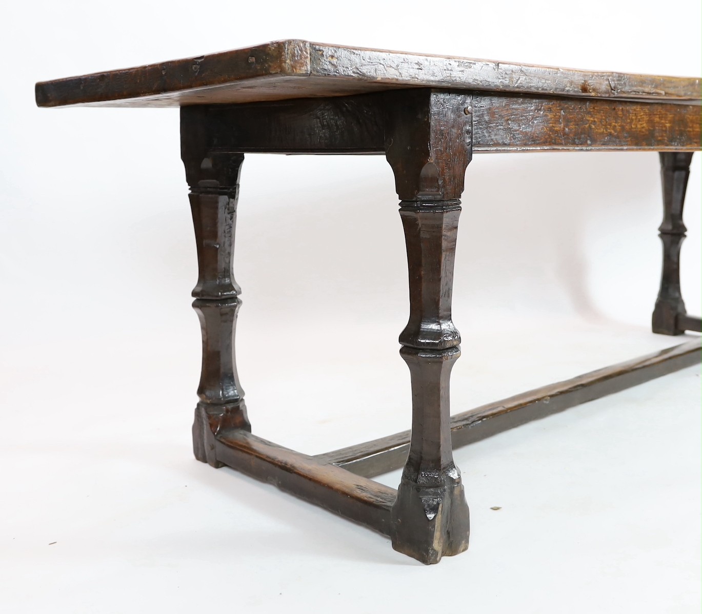 A Charles I oak refectory table, c.1630, 253 x 77cm, height 79cm